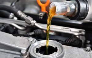 Pouring Oil in Car