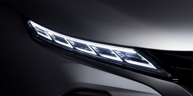 Image of the 2024 Mitsubishi Outlander featuring a close-up of the headlights
